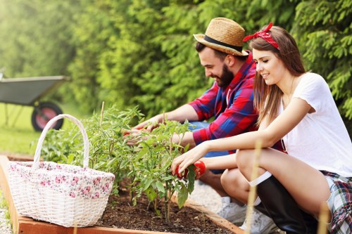 A gardener reviewing a complaint procedure before a maintenance visit